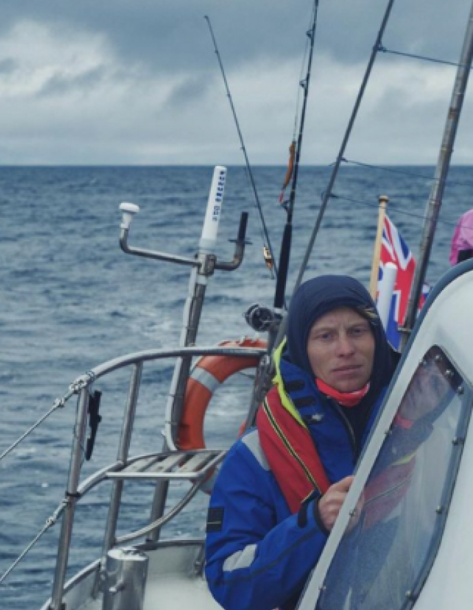 isak rockström leaning on boat